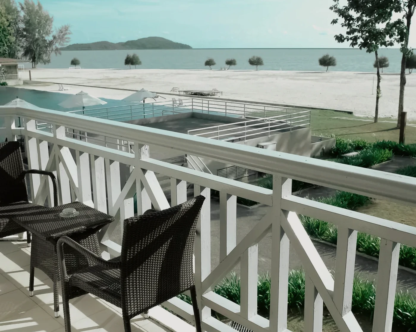 Balcony seating overlooking a luxury coastal property near Los Angeles style leisure travel.